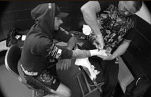 Scott Rehm wrapping Bobby Flynn's hands before a mma fight
